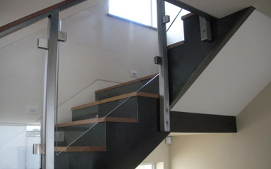 glass railing on a stairway installed by our professionals in Irvine