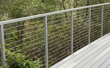 Irvine stainless steel railing matching the deck wood