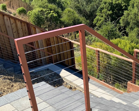 Hand railings and cable system installed on stairs